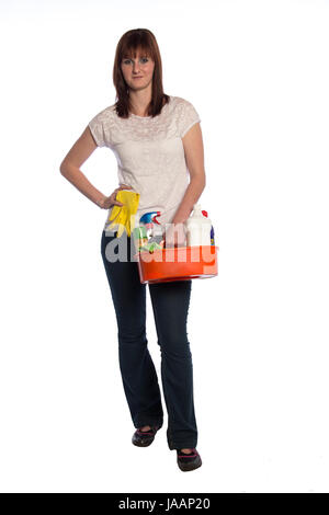 Young woman with a bucket filled with cleaning materials isolated on white background Stock Photo