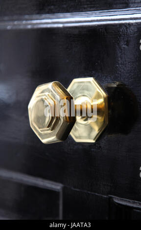 A typically British brass door knob on a front door on a central London street, UK Stock Photo