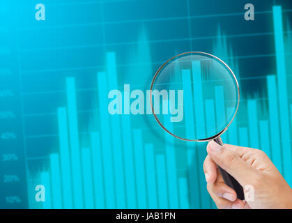 magnifying glass zoom on a business chart Stock Photo