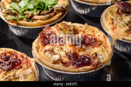 Brie and cranberry tartlets. Stock Photo