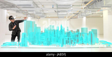 Virtual reality technology, hologram and smart city concept. Business man suit wearing VR glasses to see 3d rendering of modern building. Stock Photo