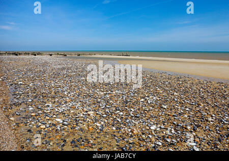 A view of mixed materials on the tidal west beach in North Norfolk at Mundesley-on-Sea, Norfolk, England, United Kingdom. Stock Photo