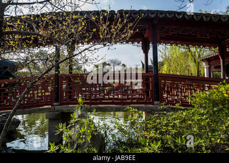 Bridge over a pond, Pearl Pagoda Garden, Ancient water town of Tongli, Suzhou, Jiangsu Province, China Stock Photo