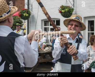 Thaxted Morris Weekend 3-4 June 2017 A meeting of member clubs of the Morris Ring celebrating the 90th anniversary of the founding of the Thaxted Morris Dancing side or team in Thaxted, North West Essex, England UK.  Members of Mayflower side from Billericay Essex outside The Crown pub at Little Walden in Essex. Hundred of Morris dancers from the UK and this year the Silkeborg side from Denmark spend most of Saturday dance outside pubs in nearby villages where much beer is consumed. In the late afternoon all the sides congregate in Thaxted where massed dancing is perfomed along Town Street. As Stock Photo