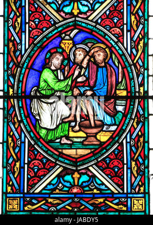 The Passion Window, Jesus washes feet of his Disciples, stained glass window by Didron of Paris, 1860, Feltwell, Norfolk, England, UK Stock Photo