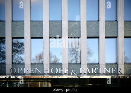 Cologne, Germany - November 24, 2016: The logo of the Economic Chancellery Oppenhoff & Partner at the Institute of German Economy above the entrance o Stock Photo
