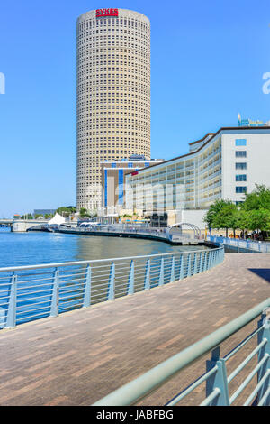 Tampa River Walk pedestrian pathway winds alongside the Rivergate building in the arts district & the Sheraton Hotel in downtown Tampa, FL Stock Photo