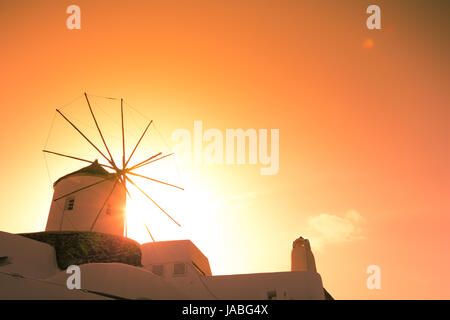 Abstract view of the cycladic style of traditional houses and windmills at Santorini, Greece. Stock Photo