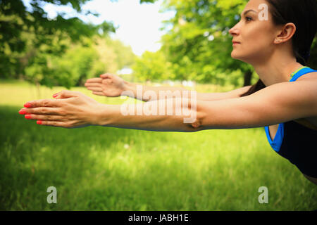 Bright sporty scene. Hands of sporty girl close-up. Stock Photo