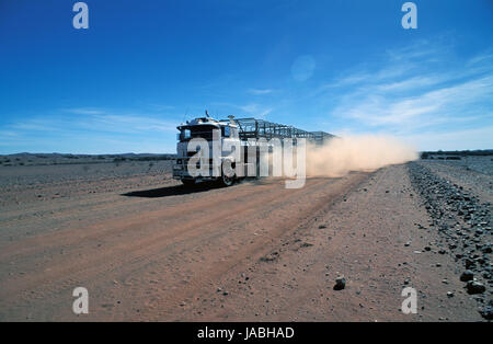 EMPTY ROAD TRAIN ON OUTBACK ROAD IN THE NORTHERN TERRITORY, AUSTRALIA Stock Photo