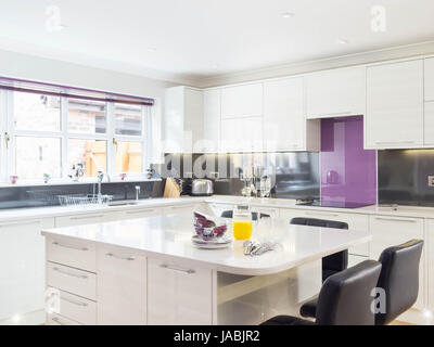 A kitchen island / breakfast bar in a modern designer kitchen Stock Photo