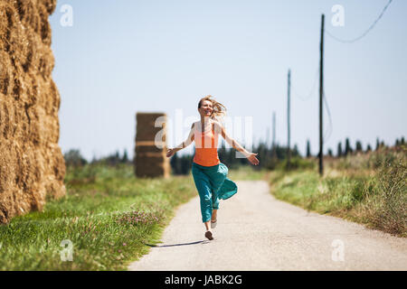 Young woman is enjoying sunny day on her journey. Stock Photo