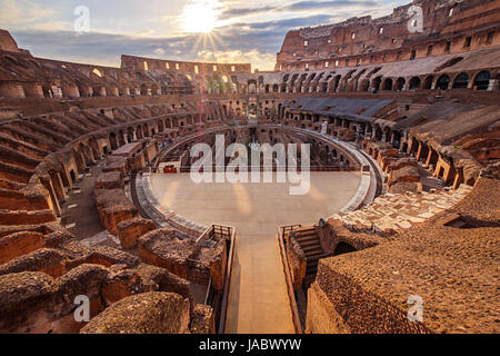 Scenic view of Roman Colosseum interior at sunset, Rome, Italy Stock Photo