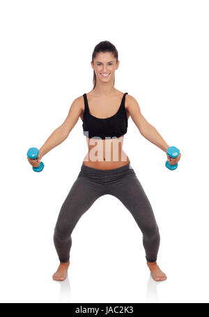 Happy brunette girl toning her muscles isolated on a white background Stock Photo