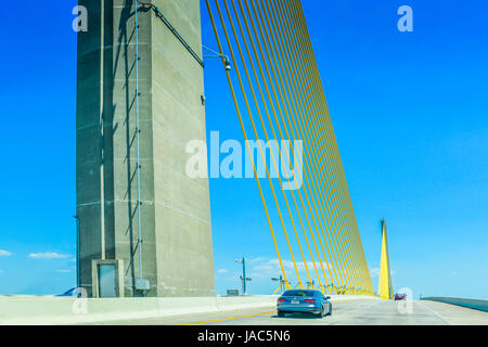 The Sunshine Skyway Bridge built over Tampa Bay is a cable stayed bridge with visually exciting yellow cables construction near St. Petersburg, FL Stock Photo