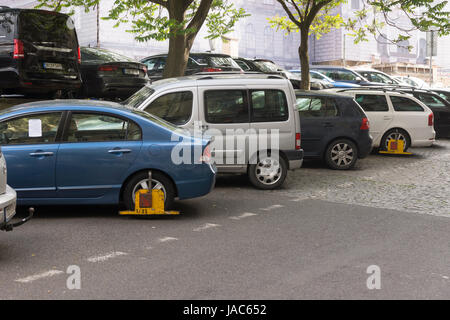 Visitors driving to Prague need to be careful to park correctly. Clamped cars near the National Museum Stock Photo