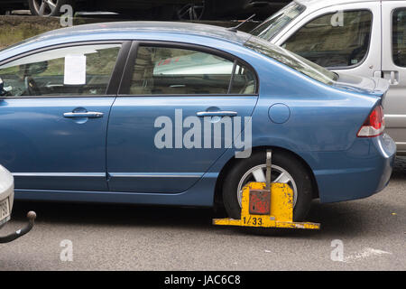 Visitors driving to Prague need to be careful to park correctly. Clamped cars near the National Museum Stock Photo