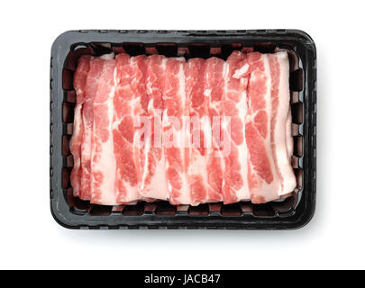 Top view of plastic disposable tray with raw sliced bacon isolated on white Stock Photo