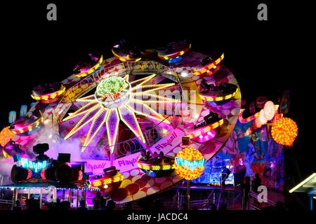 MUNICH, GERMANY - SEPTEMBER 25: Carousell at the Oktoberfest in Munich, Germany on September 25, 2013. The Oktoberfest is the biggest beer festival of the world with over 6 million visitors each year. Stock Photo