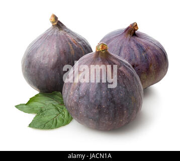 Three figs and green leaves isolated on white Stock Photo