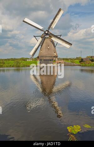 Windmill beside a canal Stock Photo