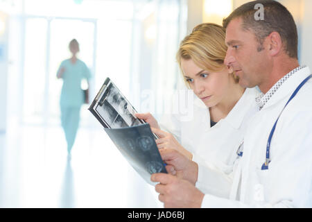 group of doctors and nurses looking at x-ray Stock Photo