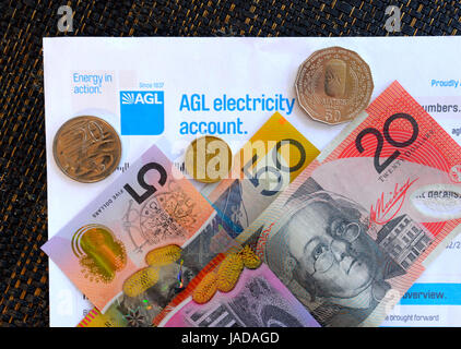 Paying an electricity bill with Australian Currency, Australian Dollars, AUD, Australia Stock Photo