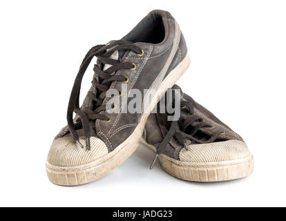 Old dirty sneakers isolated on white background Stock Photo