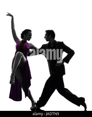 one caucasian couple man woman ballroom dancers tangoing  in silhouette studio isolated on white background Stock Photo