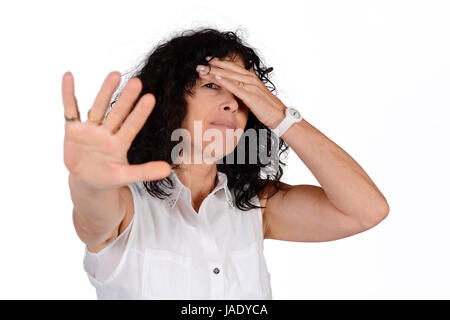 Woman doing stop gesture with hand. Isolated white background. Stock Photo