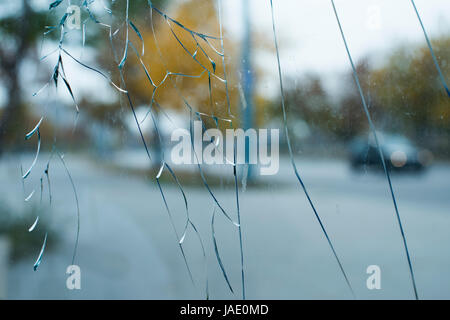Cracked glass and city background Stock Photo
