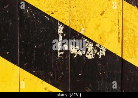 background texture from painted wood with black and yellow diagonal stripes Stock Photo