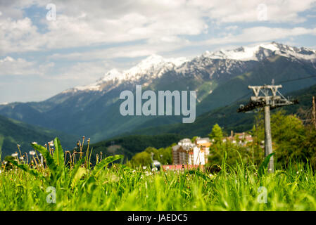 Mountain Village in the summer. Rosa Khutor, Adler. Morning view of the plateau, hotel complexes and mountains. Stock Photo