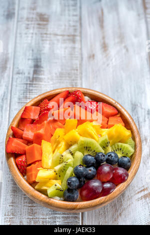 Breakfast oatmeal for kids topped with rainbow fruits