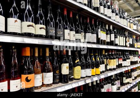 Large selection of wine for sale on store shelves Stock Photo