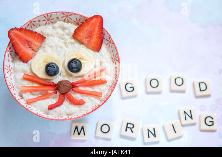 Oatmeal porridge with a kitten face decoration Stock Photo