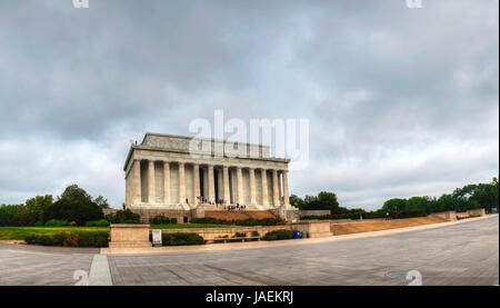 WASHINGTON, DC - MAY 9: The Lincoln Memorial with tourists on May 9, 2013 in Washington, DC. It's an American national monument built to honor the 16th President of the United States, Abraham Lincoln. It is located on the National Mall in Washington, D.C. across from the Washington Monument. Stock Photo