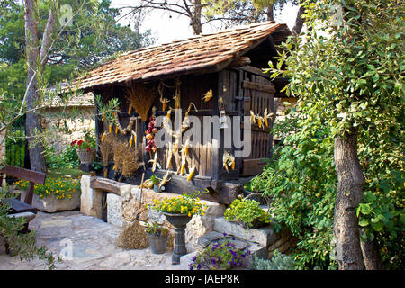 Traditional wooden corn drier store with ornaments, Croatia Stock Photo