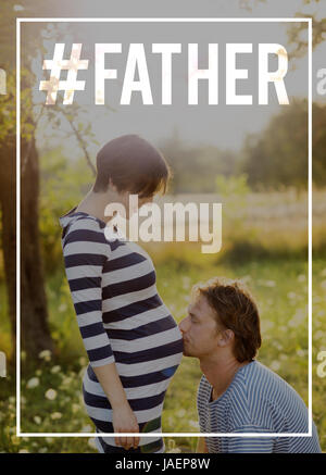 Young father kissing belly of his pregnant wife. Fathers day. Stock Photo