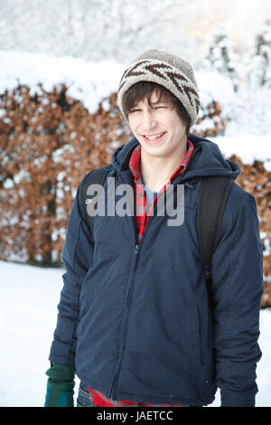 Portrait of Caucasian teenage boy in winter setting and warm clothing, UK Stock Photo