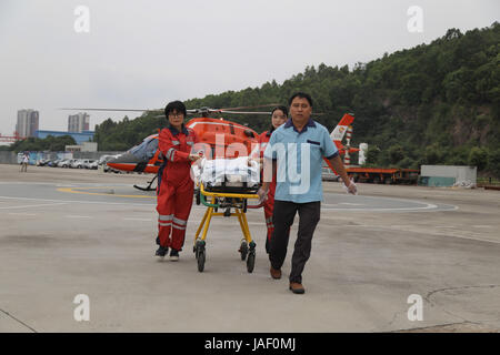 June 5, 2017 - Guangzhou, Guangzhou, China - Guangzhou, CHINA-June 5 2017: (EDITORIAL USE ONLY. CHINA OUT) ..A rescue drill of air ambulance helicopter is held in Guangzhou, capital of south China's Guangdong Province, June 2nd, 2017. It only takes less than 15 minutes to send a patient from the accident site to the emergency room. (Credit Image: © SIPA Asia via ZUMA Wire) Stock Photo