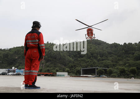 June 5, 2017 - Guangzhou, Guangzhou, China - Guangzhou, CHINA-June 5 2017: (EDITORIAL USE ONLY. CHINA OUT) ..A rescue drill of air ambulance helicopter is held in Guangzhou, capital of south China's Guangdong Province, June 2nd, 2017. It only takes less than 15 minutes to send a patient from the accident site to the emergency room. (Credit Image: © SIPA Asia via ZUMA Wire) Stock Photo