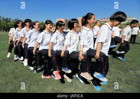 Naked Chinese candidates take part in a physical examination for the