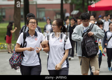 Shanghai, China. 7th June, 2017. Examinees walk out of the exam venue after taking the first test of the national college entrance examination at No. 4 Middle School in Shanghai, east China, June 7, 2017. A total of 9.4 million Chinese students sit the annual national college entrance examination from Wednesday. Credit: Du Xiaoyi/Xinhua/Alamy Live News Stock Photo