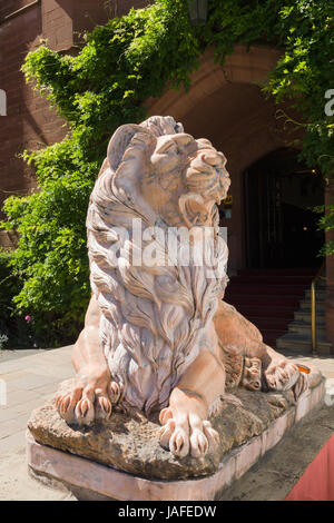 Ruthin Castle hotel marble lion outside the main entrance Stock Photo