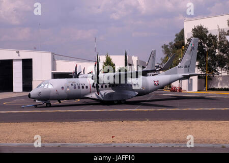 An EADS CASA C-295 twin-turboprop tactical military transport aircraft of the Mexican Navy one of the two independent Armed Forces of Mexico, stands at the tarmac of Mexico City International Airport Stock Photo