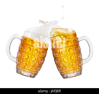 two mugs of beer toasting creating splash isolated on white background. Pair of beer mugs making toast. Beer up. Golden beer splash Stock Photo