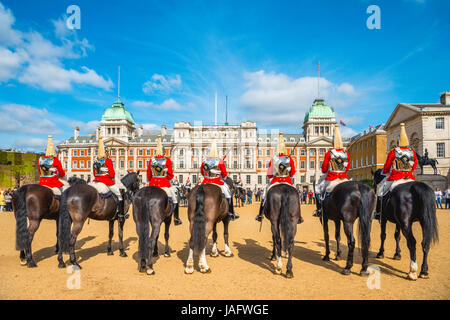 The Royal Guards in red uniform on horses, The Life Guards, Household Cavalry Mounted Regiment, parade ground Horse Guards Stock Photo