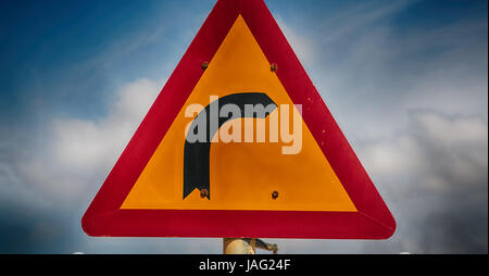 road signal attention of the curve in the sky like abstract background Stock Photo