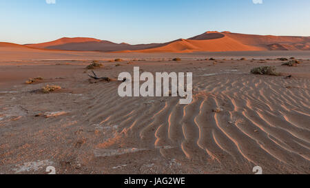 Sunrise in the dunes at Sossusvlei, part of the Namib Naukluft Park in Namibia Stock Photo